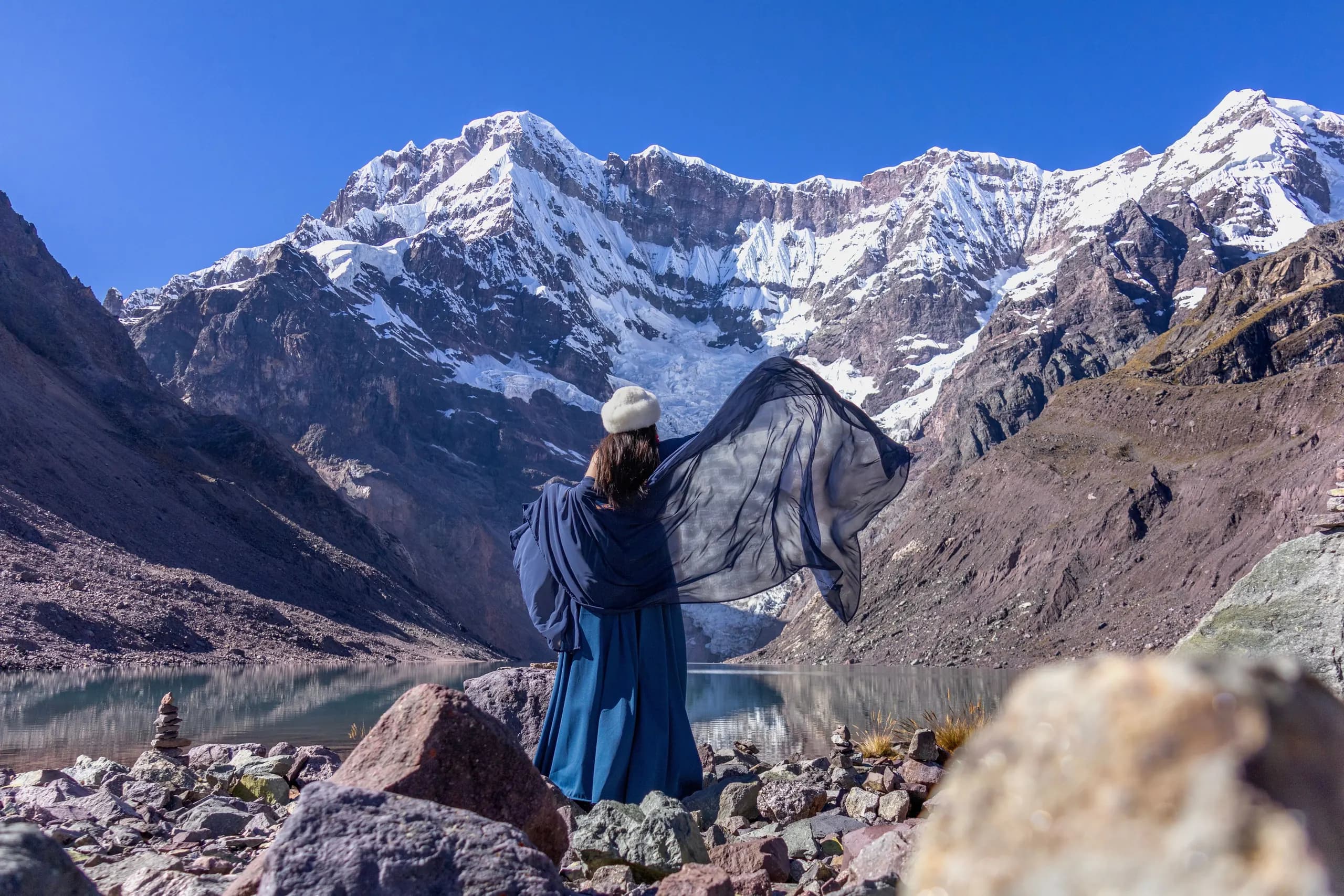 © Dulce Panebra · Pexels A person looking towards Humantay Lake and the snow-covered Salkantay peaks