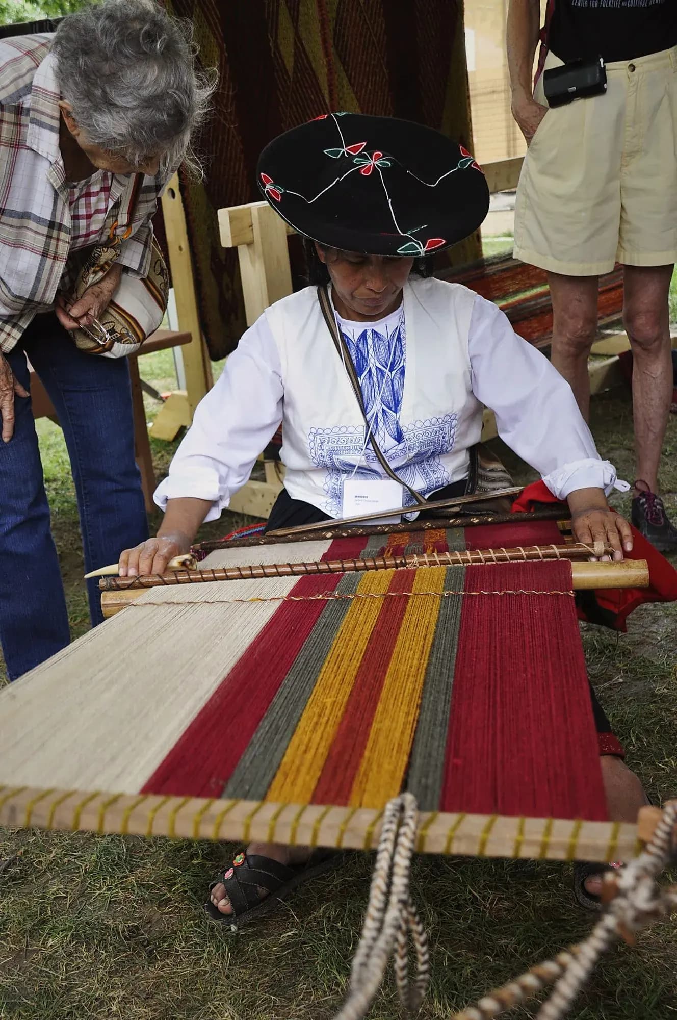 © Jarek Tuszyński · Wikimedia Commons Cusco weaver working at a loom
